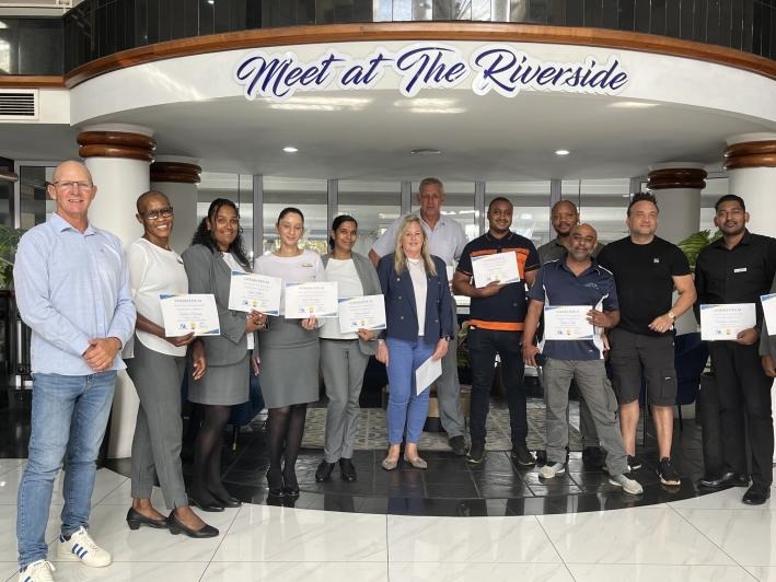 The Riverside Hotel management team completing their Gen AI Innovation workshop